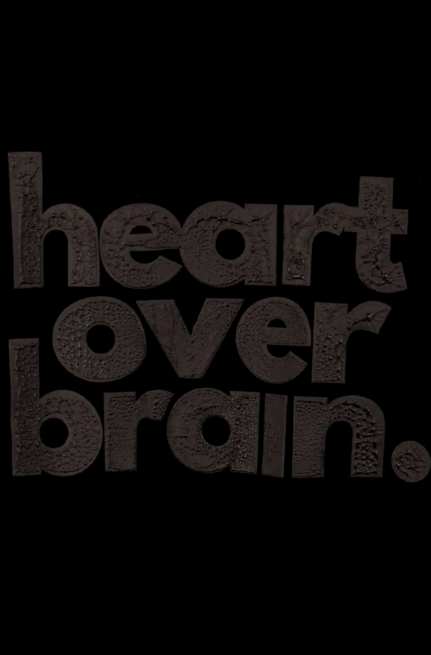 heart over brain. - black on black.