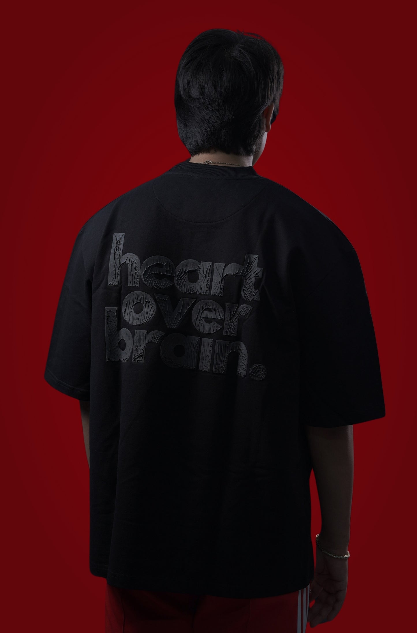 heart over brain. - black on black.